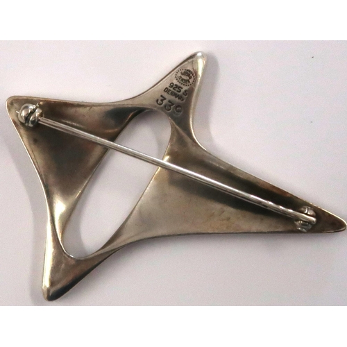 23 - Georg Jensen silver brooch of abstract star form, designed by Henning Kopel, model 399, width 56mm, ... 