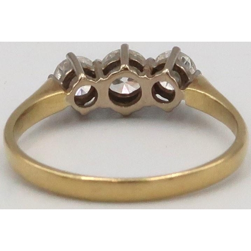 45 - An 18ct Yellow Gold three stone diamond ring. Estimated total diamond weight 0.65ct. Estimated colou... 