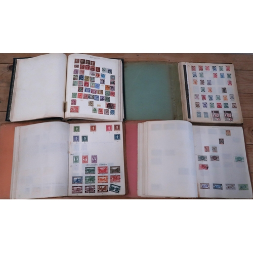 470 - Four stamp albums containing world stamps, penny reds amongst.