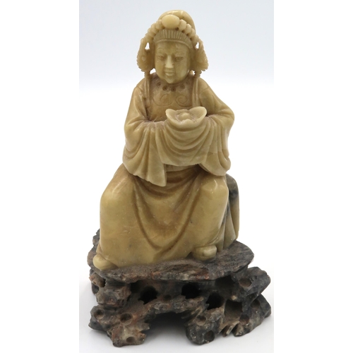 472 - An Oriental soapstone figure of a seated gentleman - Height 16cm