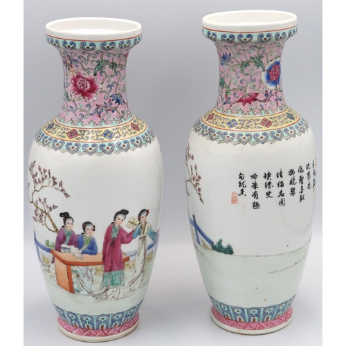 479 - A pair of hand painted Oriental famille rose ceramic vases, floral border to top and geometric borde... 