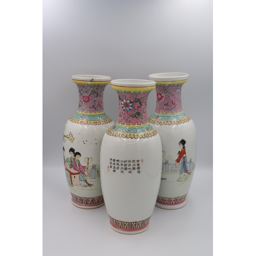 480 - A pair of hand painted Oriental famille rose ceramic vases, floral border to top and geometric borde... 