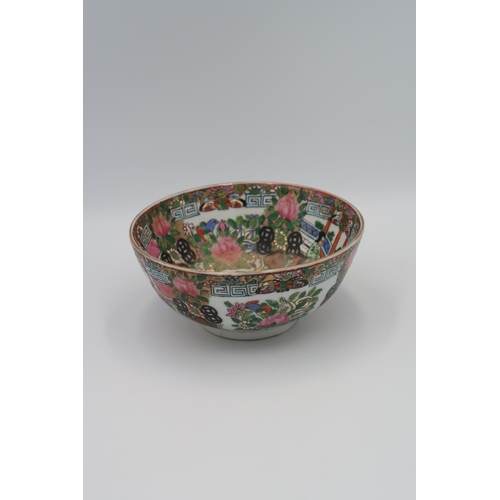 483 - An Oriental Cantonese bowl decorated with figures amongst background, 7cm high x 15cm diameter