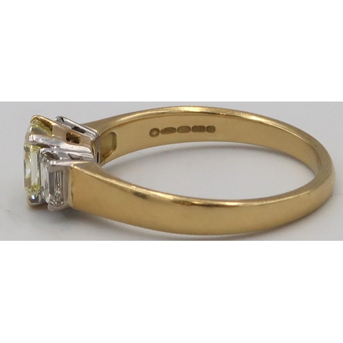 5 - An 18ct yellow gold three stone Diamond ring, the central Fancy Yellow Diamond estimated weight 1.03... 