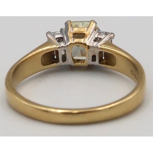 5 - An 18ct yellow gold three stone Diamond ring, the central Fancy Yellow Diamond estimated weight 1.03... 