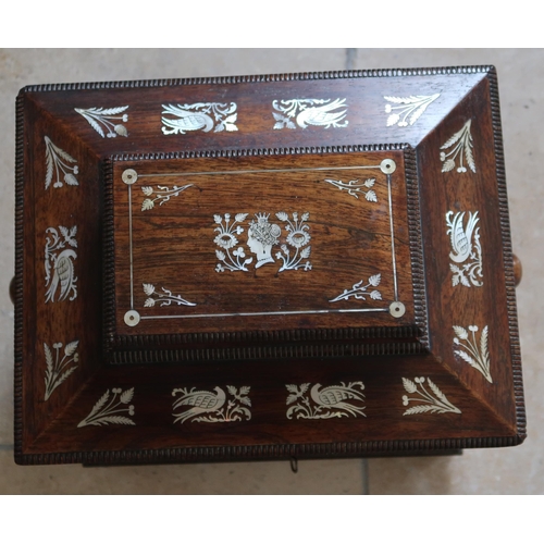 513 - A mahogany and mother of pearl inlaid Jewellery box, two doors opening to reveal drawers.