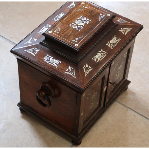 513 - A mahogany and mother of pearl inlaid Jewellery box, two doors opening to reveal drawers.