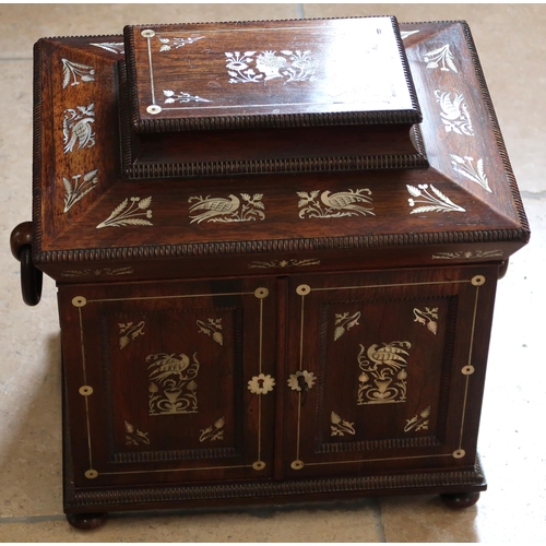 513 - A mahogany and mother of pearl inlaid Jewellery box, two doors opening to reveal drawers.