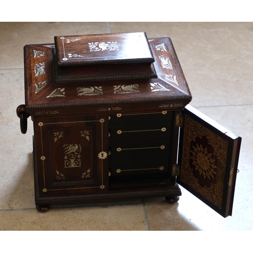 513 - A mahogany and mother of pearl inlaid Jewellery box, two doors opening to reveal drawers.