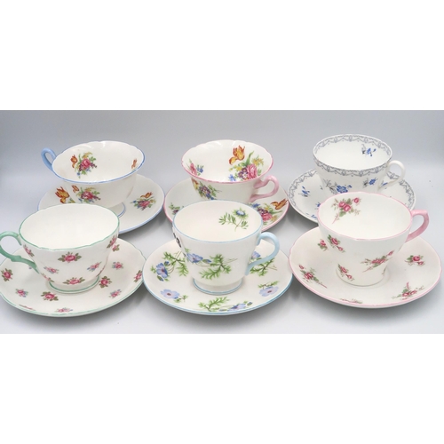 518 - A Shelley Pattern 2514 cup and saucer, Charm cup and saucer, Adderley cup and saucer, Rosebud cup an... 