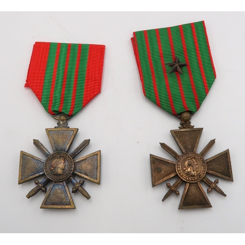 527 - A 1914-17 Croix De Guerre and a 1939-40 Croix De Guerre medal.