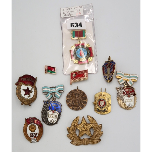 534 - A group of Soviet enamel badges and a Chernobyl medal.