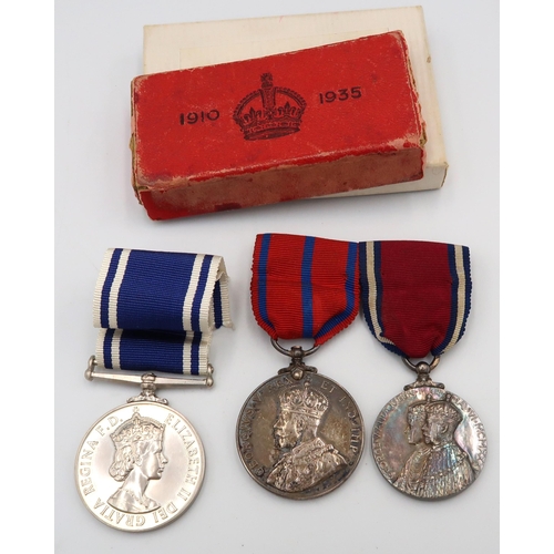 544 - Three medals including 1911Metropolitan Police Coronation, George V commemorative medal and a for Ex... 