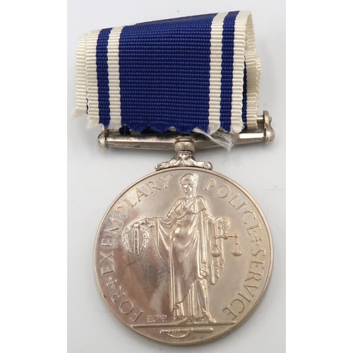 544 - Three medals including 1911Metropolitan Police Coronation, George V commemorative medal and a for Ex... 