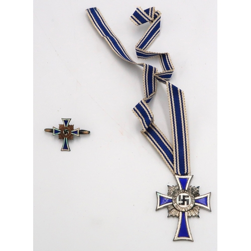 547 - WW2 German Mothers silver cross with Hitlers signature to back, and a lapel badge.