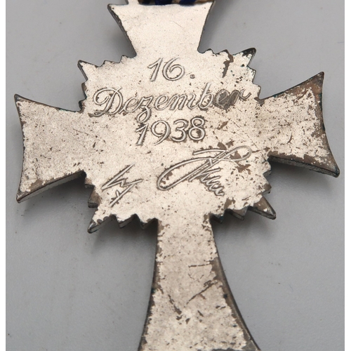 547 - WW2 German Mothers silver cross with Hitlers signature to back, and a lapel badge.