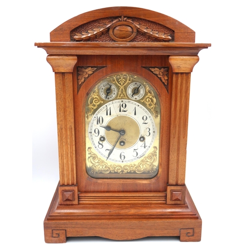 611 - A mahogany cased mantle clock, gilt face with Arabic numerals to silvered chapter ring, subsidiary d... 