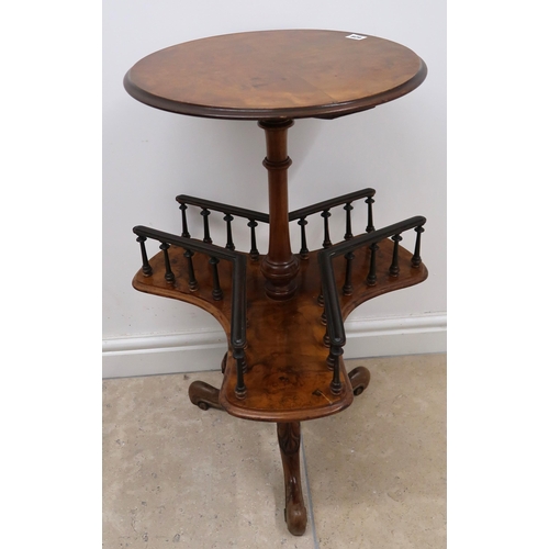 628 - A Walnut two tier occasional table with circular top 44.5cm dia. lower triform galleried tier raised... 