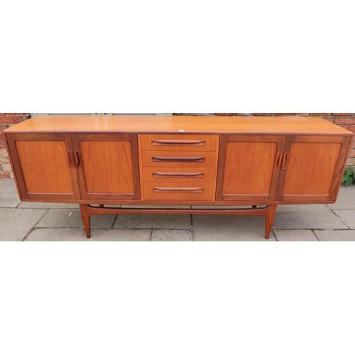 631 - A Mid 20th Century G-Plan Fresco sideboard, Four central drawers flaked by four doors. 213cm long x ... 