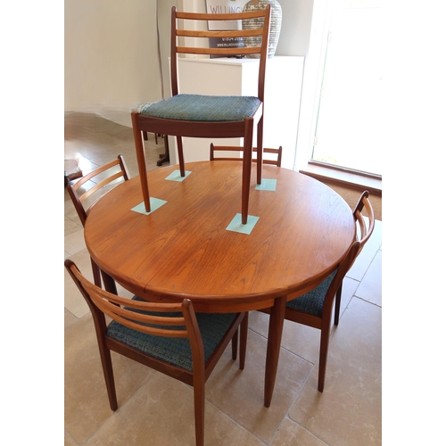 632 - A Mid 20th Century G-Plan extendable dining table and five dining chairs. extended size 167cm long, ... 