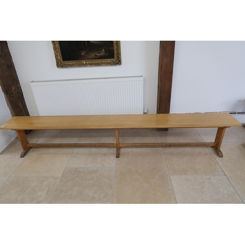 635 - An oak bench removed from The Leys School, Cambridge, 280cm long x 47cm high