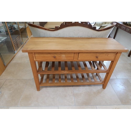 650 - A light oak two tier kitchen table with two drawers raised on square supports - Width 140cm x Depth ... 