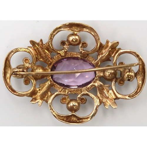 8 - A 9ct gold amethyst and cultured pearl openwork brooch. Length 40mm. Weight 7.40 grams