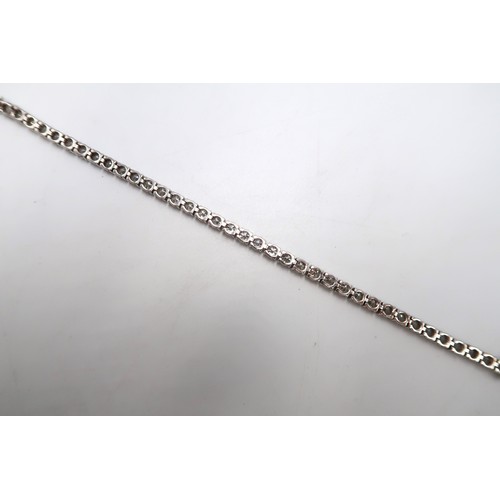 40 - A brilliant cut diamond tennis bracelet. Estimated total weight 6.56cts. Estimated G/H colour, SI1/S... 