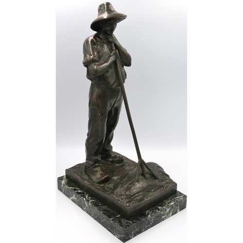 A bronze sculpture of a Worker.