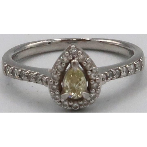 75 - A platinum pear shape diamond cluster ring. The central yellow pear shape diamond estimated 0.19ct, ... 