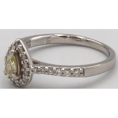 75 - A platinum pear shape diamond cluster ring. The central yellow pear shape diamond estimated 0.19ct, ... 