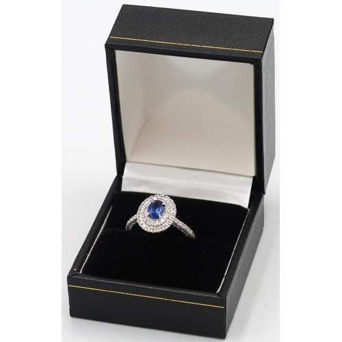 109 - A quality platinum sapphire and diamond oval ring, sapphire a good colour surrounded by approx 1ct o... 