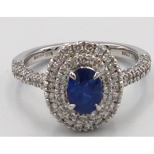 109 - A quality platinum sapphire and diamond oval ring, sapphire a good colour surrounded by approx 1ct o... 