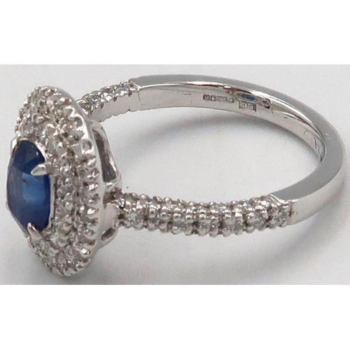 109 - A quality platinum sapphire and diamond oval ring, sapphire a good colour surrounded by approx 1ct o... 