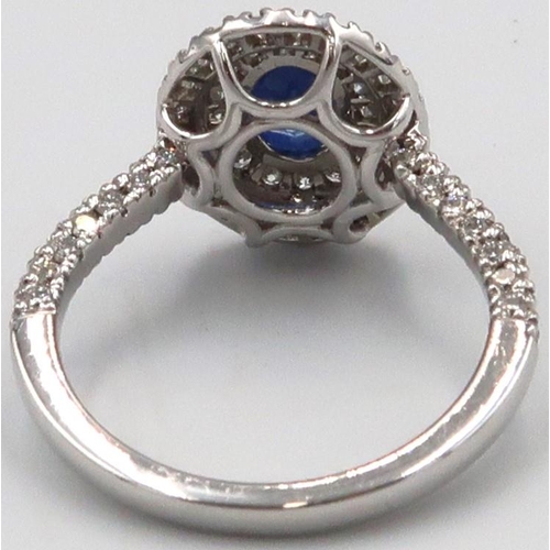 109 - A quality platinum sapphire and diamond oval ring, sapphire a good colour surrounded by approx 1ct o... 