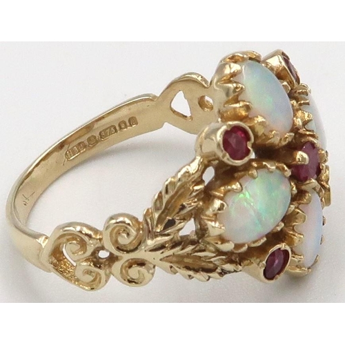 117 - A 9ct yellow gold Victorian style opal and ruby ring, opals are a good colour and well matched, head... 