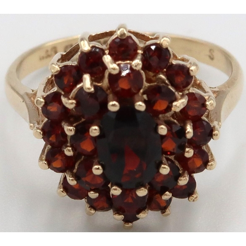 132 - A 9ct yellow gold garnet cluster ring, head size approx 17mm x 15mm, size O, weight 3.78 grams