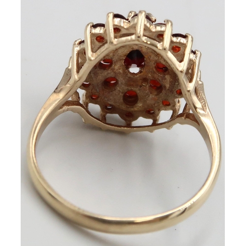 132 - A 9ct yellow gold garnet cluster ring, head size approx 17mm x 15mm, size O, weight 3.78 grams