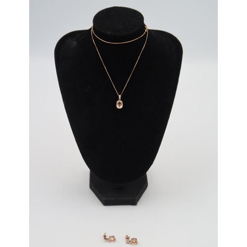 26 - A cubic zircona pendant on a 9ct gold chain, with earrings, approx. Total weight 3.40 grams