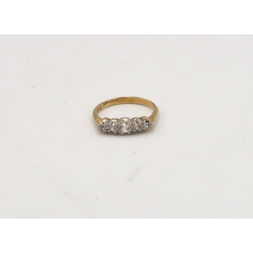 88 - A cubic zirconia five stone ring, stamped 18ct, Size I, weight 2.06 grams