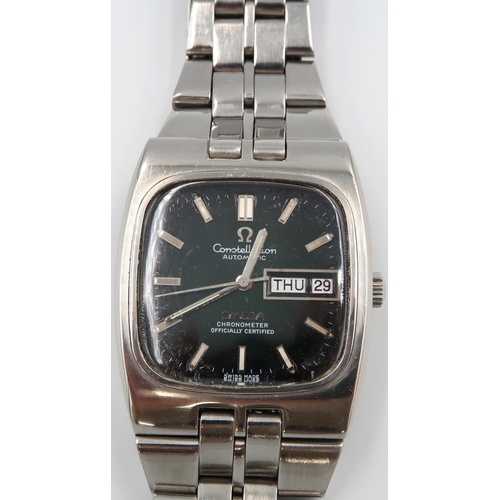 267 - An Omega Constellation in stainless steel case on a stainless steel bracelet strap - ticks but stops... 