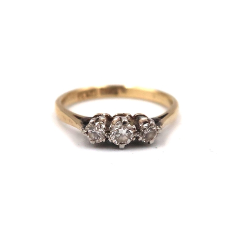 167 - A brilliant cut diamond three stone ring. Stamped 18ct and plat. Estimated 0.25ct total weight. Size... 