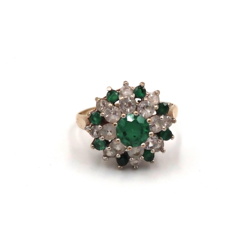 169 - A 9ct gold green and white paste stone cluster ring. Size N 1/2. Weight 3.11 grams.