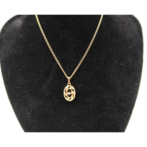 170 - A 9ct gold oval openwork pendant with diamond highlight. Suspended from a curb link chain. Weight 4.... 