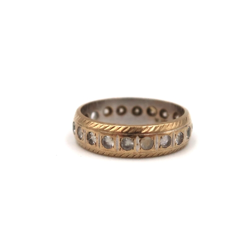 172 - A 9ct gold white stone full eternity ring. Size K. Weight 2.49 grams. One stone missing.