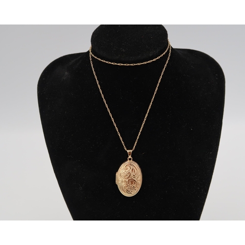 173 - A 9ct gold oval locket and chain. Weight 3.88 grams.