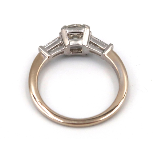 179 - An 18ct gold diamond ring, the centre stone approx 0.80ct, colour approx G/H, VS1 with tapered bague... 