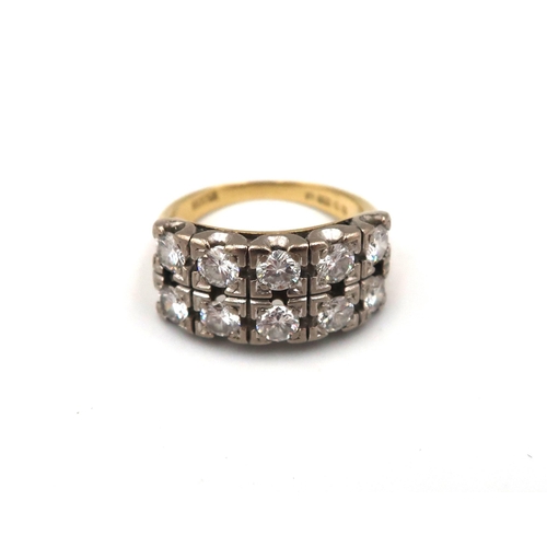 192 - An 18ct yellow gold and diamond ring with 10 0.1ct diamonds to shoulder, approx 7.8 grams, size K/L