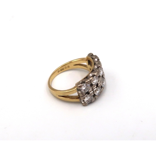 192 - An 18ct yellow gold and diamond ring with 10 0.1ct diamonds to shoulder, approx 7.8 grams, size K/L