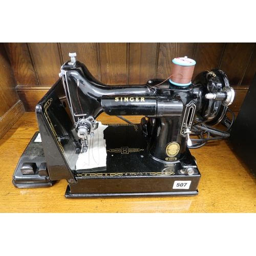 507 - A Singer Electric 221K sewing machine in its original case - in working order but needs an electrica... 